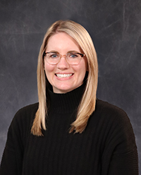 Audrey_Shaw_200x250 Audrey Show portrait, showing head and shoulders, smiling, on a gray background