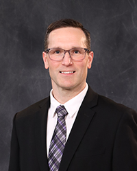 Chris_Hamlyn_200x250 Chris Hamlyn portrait, showing head and shoulders, smiling, on a gray background