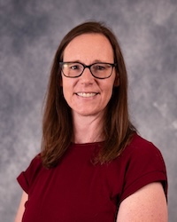 Professional headshot of Rachel Sternquist against a grey background.