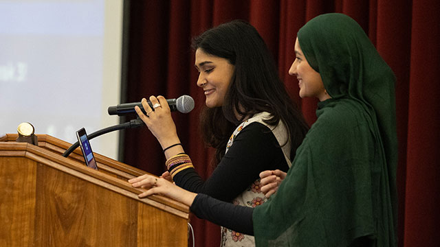 Two students dressed in cultural clothing celebrating APAHM